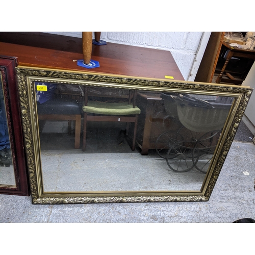 418 - Two contemporary wall mirrors, one gilt frame with rectangular glass plate, the other wood framed wi... 