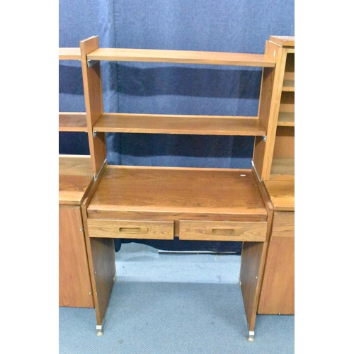 457 - A 1960s light elm desk, having a glazed section with two sliding doors and open shelves, above drawe... 