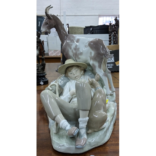 427 - A Lladro figure of boy asleep with two dogs and a goat, 35cm h, Location:2:1