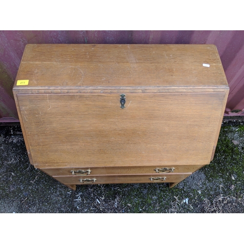 445 - A modern light oak bureau with a fall flap over two drawers, raised on straight legs, 101h x 76w, a ... 