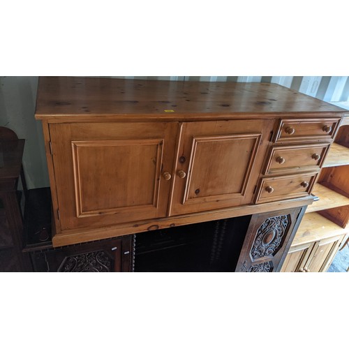 445 - A modern light oak bureau with a fall flap over two drawers, raised on straight legs, 101h x 76w, a ... 