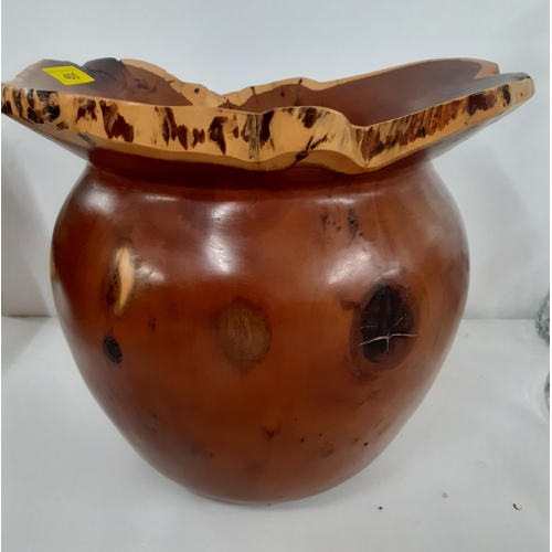 433 - A Terry Harvey hand turned yew planter dated 1996 with label and carved insignia to the base, 27cm H... 