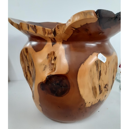 433 - A Terry Harvey hand turned yew planter dated 1996 with label and carved insignia to the base, 27cm H... 