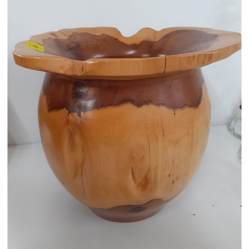 434 - A Terry Harvey hand turned yew planter, label and carved insignia to base, 28cm High x 15cm internal... 