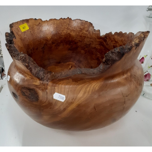 435 - A Terry Harvey hand turned burr wych elm planter, label and carved insignia to base, 27cm High x 29c... 