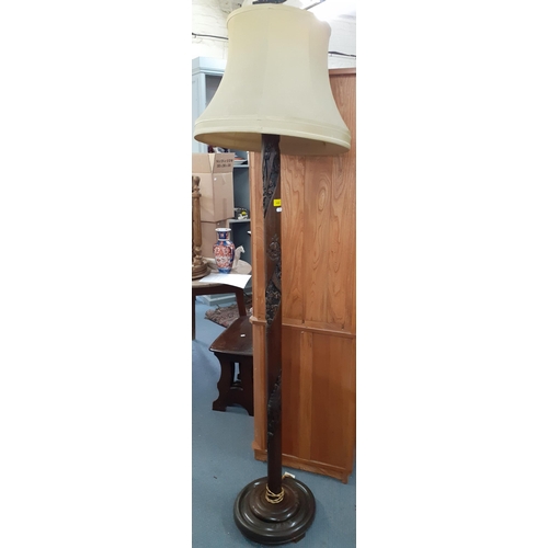 440 - A Chinese carved hardwood standard lamp with pale green shade. Location:A3B