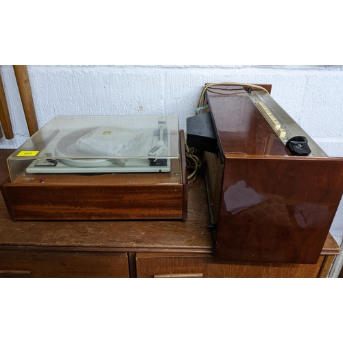 471 - A mid-century teak cased stereo record deck, and a Rigonda Marksman stereo audio radio with speaker ... 