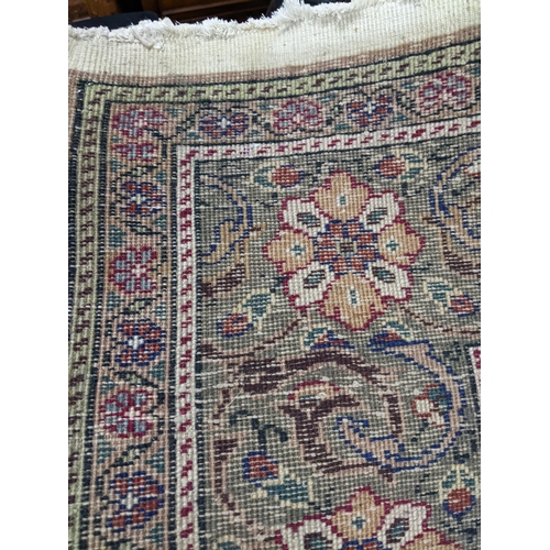 463 - A Turkish hand woven woollen carpet, central floral medallion surrounded by all over floral designs,... 