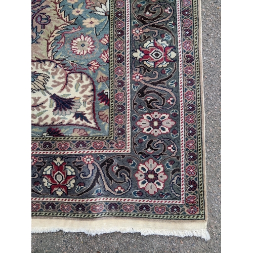 463 - A Turkish hand woven woollen carpet, central floral medallion surrounded by all over floral designs,... 