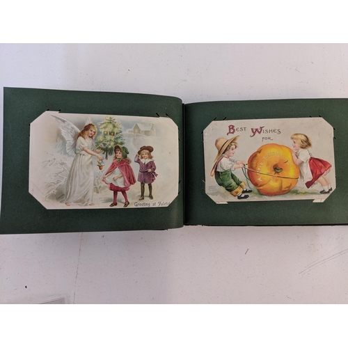 448 - Three postcard albums to include examples from the late 19th/early 20th century, also ones depicting... 