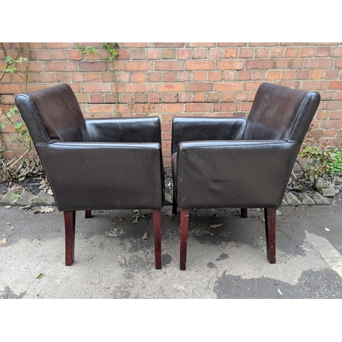 469 - A pair of modern brown leather upholstered armchairs, and a beige fabric low chair Location:RCON