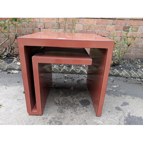 509 - A modern metal framed table with a glass top and a matching lamp table, a red modernist style lamp t... 