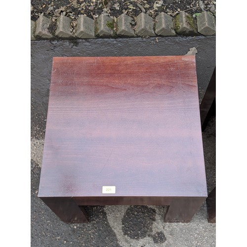 509 - A modern metal framed table with a glass top and a matching lamp table, a red modernist style lamp t... 