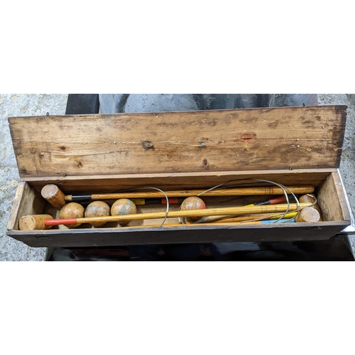 383 - An Edwardian child's croquet set in a pine carrying case Location:G