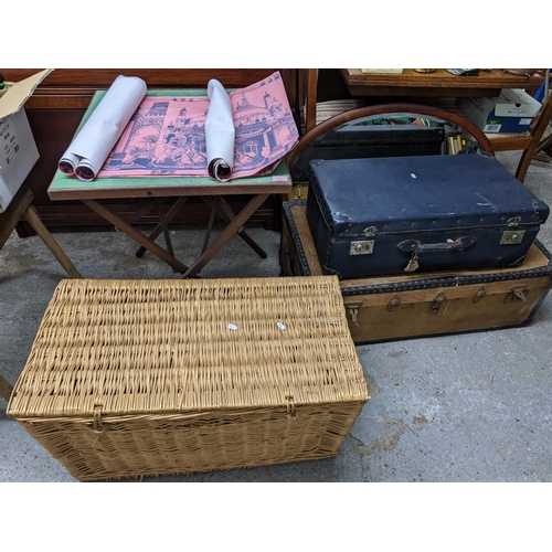 475 - A mixed lot to include a wicker basket, two suitcases, a folding card table, various Brighton Pavili... 