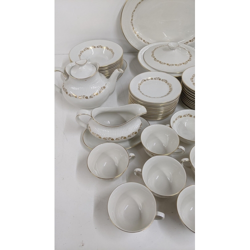 492 - A royal Doulton Fairfax dinner service to include a pair of treen, teapot, sauce boat, two platters ... 