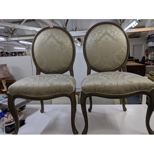 499 - A pair of modern hall chairs with upholstered back and overstuffed seats in a green floral fabric ra... 