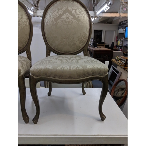 499 - A pair of modern hall chairs with upholstered back and overstuffed seats in a green floral fabric ra... 