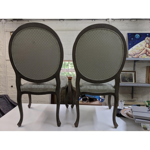 499 - A pair of modern hall chairs with upholstered back and overstuffed seats in a green floral fabric ra... 