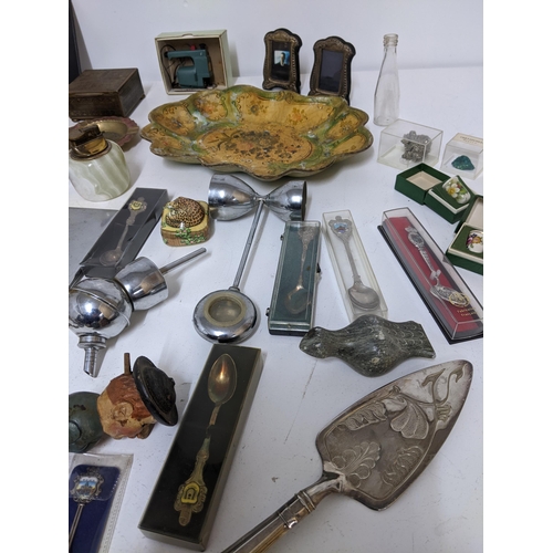 502 - A mixed lot to include two silver photograph frames, a John Sterling lighter and others, celluloid l... 