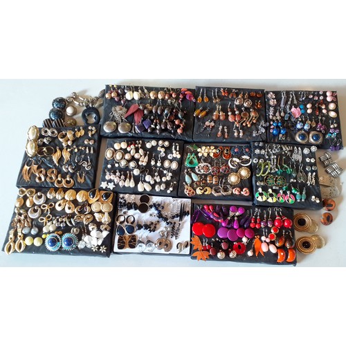 62 - A large quantity of late 20th Century and later fashion earrings to include amber effect, gold tone,... 