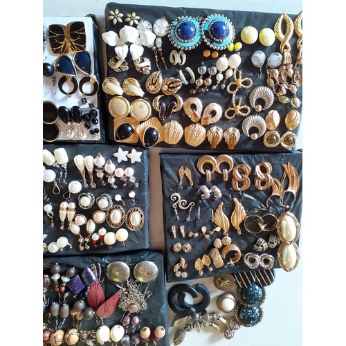 62 - A large quantity of late 20th Century and later fashion earrings to include amber effect, gold tone,... 