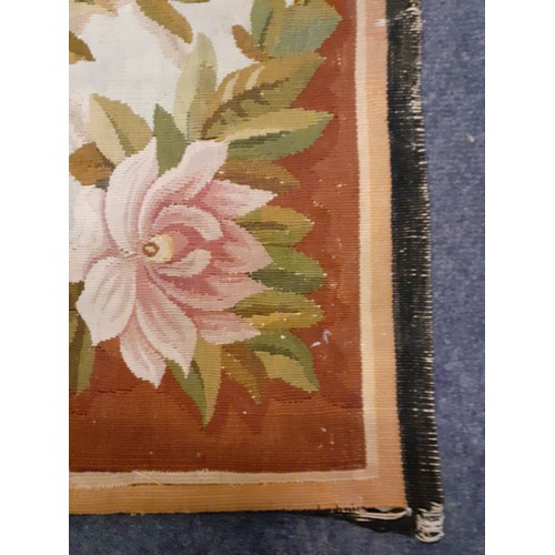 63 - A 20th Century Aubusson rug A/F originally purchased from the C John Mayfair Gallery having a pink g... 