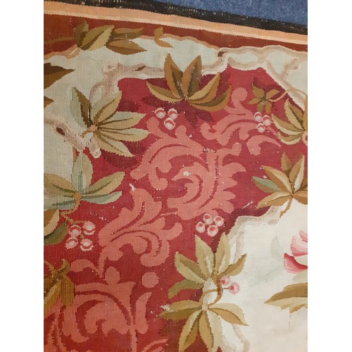 63 - A 20th Century Aubusson rug A/F originally purchased from the C John Mayfair Gallery having a pink g... 