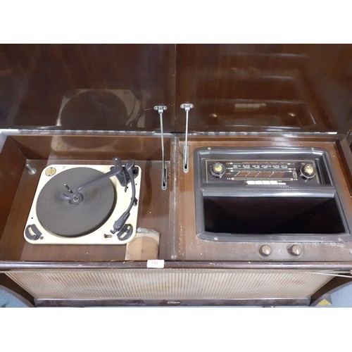 194 - A mid 20th Century RGD rosewood veneered cabinet containing a RGD radiogram and a Garrard turntable ... 