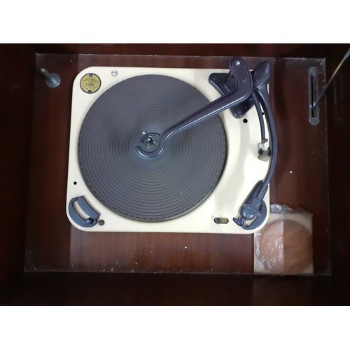 194 - A mid 20th Century RGD rosewood veneered cabinet containing a RGD radiogram and a Garrard turntable ... 