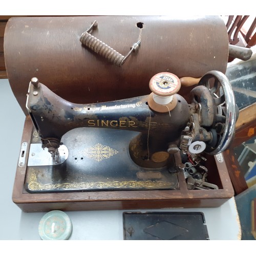 65 - Three ostrich eggs A/F, together with an oak dome cased singer sewing machine, serial no Y8917673 an... 