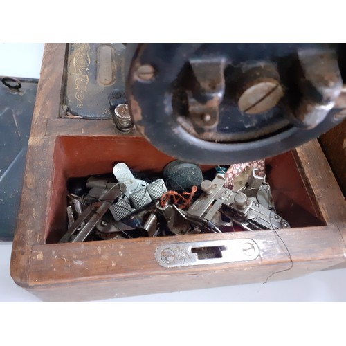 65 - Three ostrich eggs A/F, together with an oak dome cased singer sewing machine, serial no Y8917673 an... 