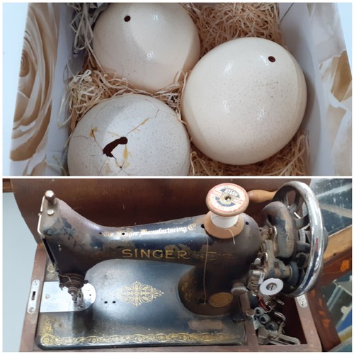 65 - Three ostrich eggs A/F, together with an oak dome cased singer sewing machine, serial no Y8917673 an... 