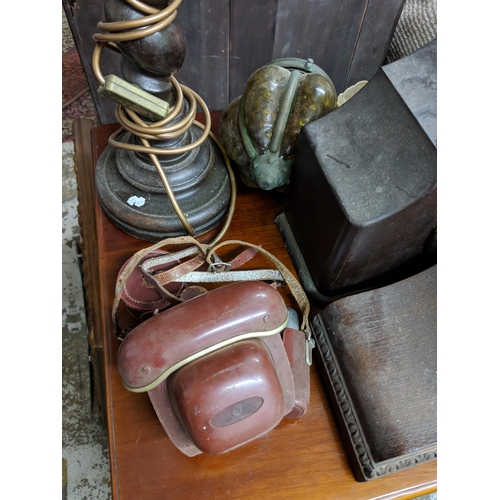 106 - A mixed lot to include a plated drinks dispenser stand, two mantel clocks, a barley twist table lamp... 