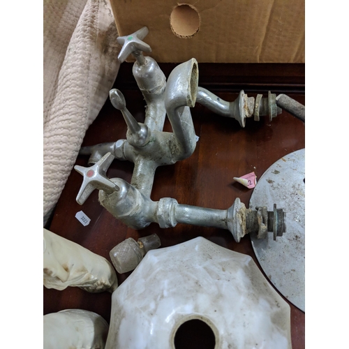 106 - A mixed lot to include a plated drinks dispenser stand, two mantel clocks, a barley twist table lamp... 