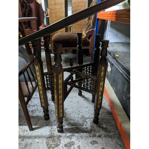102 - An Edwardian mahogany two tier occasional table, a middle Eastern brass topped table, the inlaid woo... 