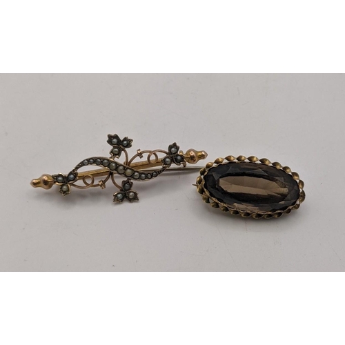 87 - Two 9ct gold brooches to include one set with an oval cut tanzanite total weight 7.3gLocation: CAB ... 