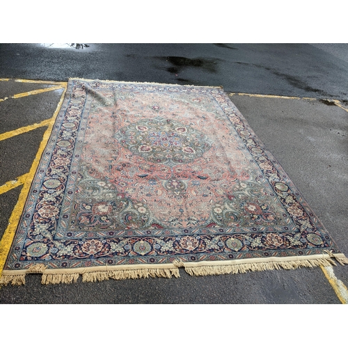 109 - A Persian Tabriz carpet, handwoven, floral pattern on a red ground, triple guard border and tasselle... 
