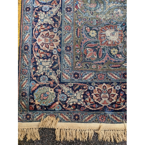 109 - A Persian Tabriz carpet, handwoven, floral pattern on a red ground, triple guard border and tasselle... 