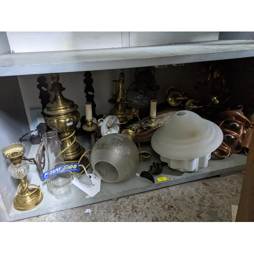 111 - A selection of lighting to include brass effect chandeliers porch and storm lanterns, some with glas... 