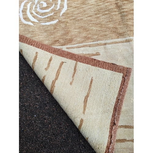 112 - A contemporary cream and beige rug with swirl and line decoration 242cm x 175cm Location:A3B