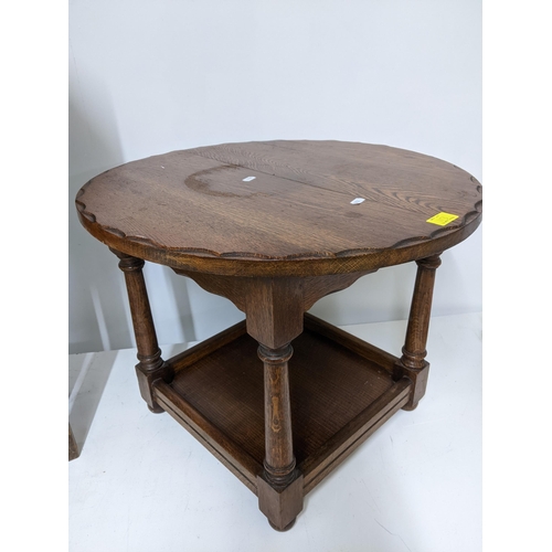 113 - An oak drop leaf gateleg table of small proportions on plain square legs 74x59x26.5cms when unextend... 