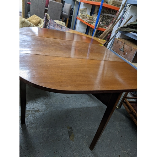 91 - A Victorian mahogany gateleg D-end table on square tapering legs 71cm x 95cm x 49cm (when unextended... 