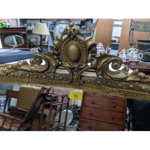 93 - Victorian gilt framed overmantel mirror surmounted with scrolled and stylized leaf decoration enclos... 