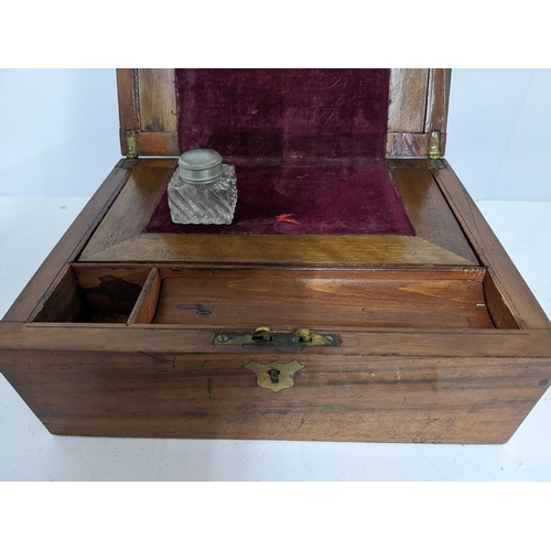 97 - A mid Victorian writing slope with single inkwell in a fitted interior 13cm x 26cm x 21cm, glass dip... 