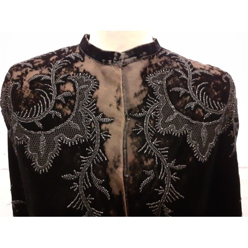 89 - A late 19th Century Madame Garnier et Cie black velvet cape A/F with black beadwork design and pocke... 