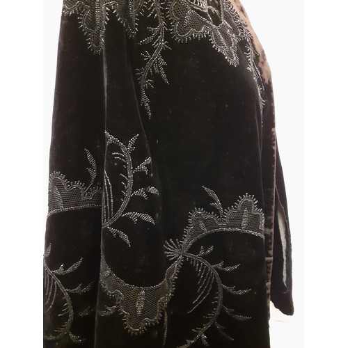 89 - A late 19th Century Madame Garnier et Cie black velvet cape A/F with black beadwork design and pocke... 