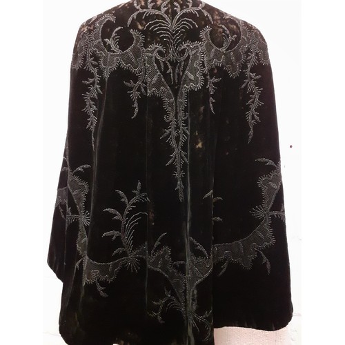 89 - A late 19th Century Madame Garnier et Cie black velvet cape A/F with black beadwork design and pocke... 