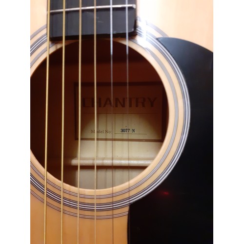 191 - A Chantry acoustic guitar in black fabric case, model no:3077N together with a black folding guitar ... 