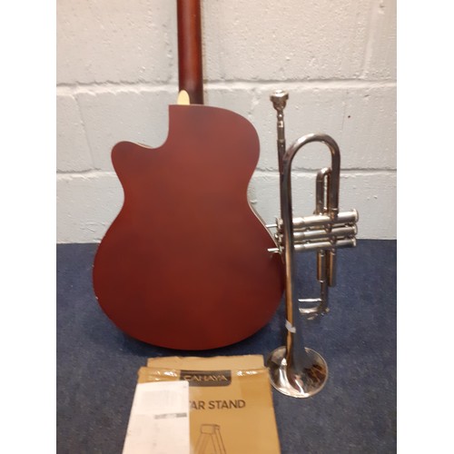 192 - A Sotendo acoustic guitar A/F, a boxed guitar stand and a Jupiter silver tone trumpet A/F model no:4... 